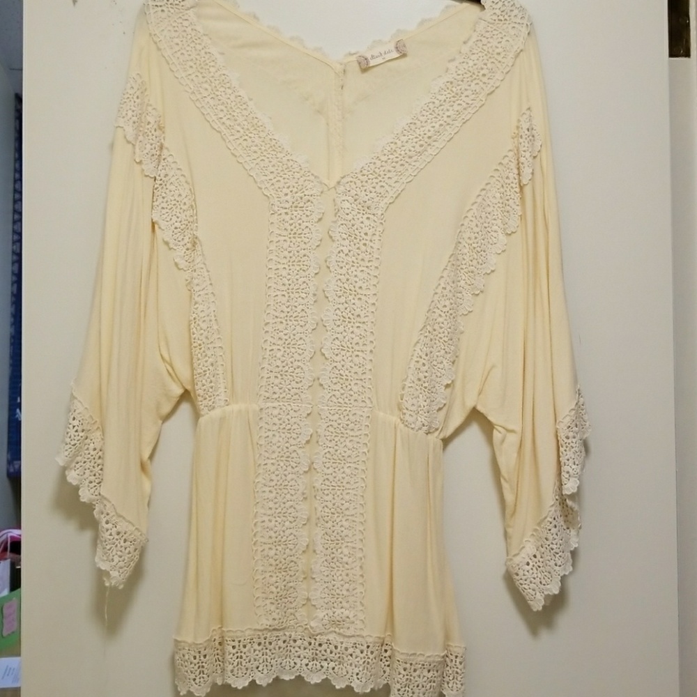 Cream blouse.